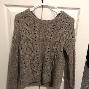 This is a grey/brownish knitted textured sweater
